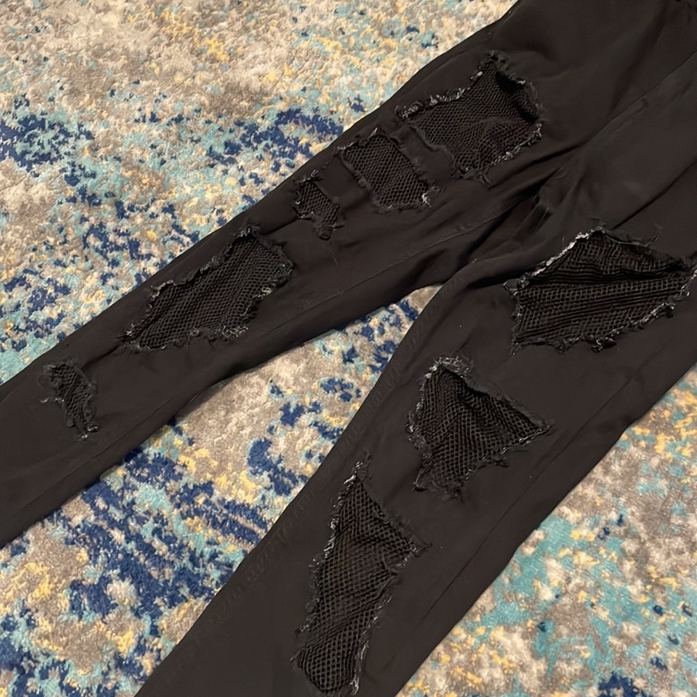 Topshop moto Jamie black jeans with fishnet mesh in holes